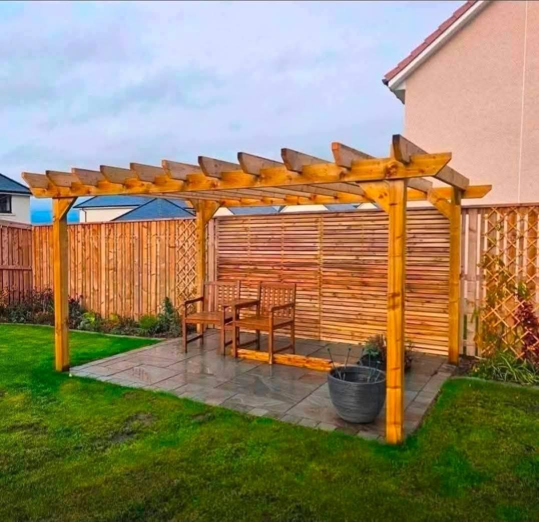 Timber pergola and paved seating area
